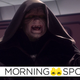 Ian McDiarmid's hooded Darth Sidious/Emperor Palpatine raises both of his open hands up as he cackles in a scene from Revenge of the Sith.